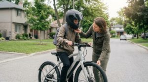 Parent and teen checking an e-bike before riding